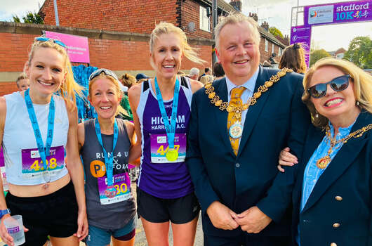 This photo is of the first 3 females. It was taken by Stafford 10K